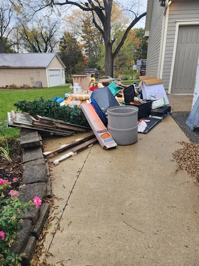 Dumpster being loaded with debris for 3 Yard Dumpster Rental in Sarasota